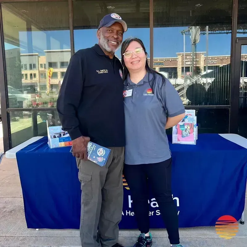 TRS Health volunteer at a community health event in Houston