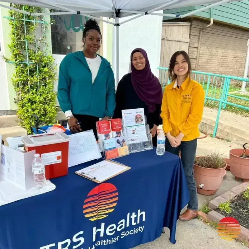TRS Health volunteer at a community health event in Houston